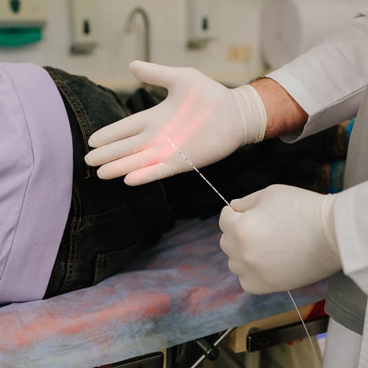 Doctor at The One Clinic Leicester consulting a patient about haemorrhoid removal